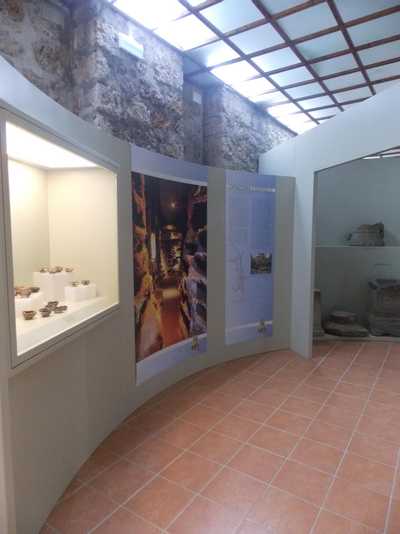 view of a room inside the civic museum of nepi with a picture of santa savinilla catacomb